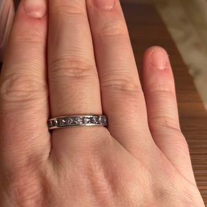 Beautiful 360 band with lab created topaz blue gems all the way around!